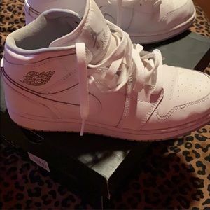 White mid top Jordans. Great condition w/ minor stain on shoe lace. Size 5Y